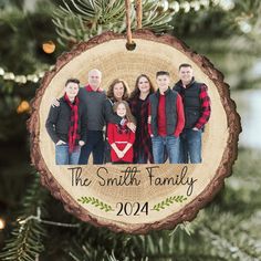 a family ornament hanging on a christmas tree