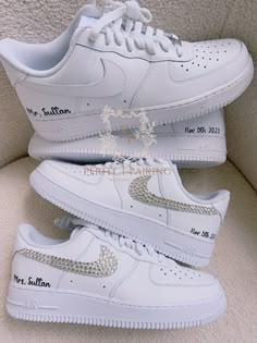 two white nike air force sneakers with swarong on them