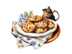 blueberry muffins on a plate with a tea pot