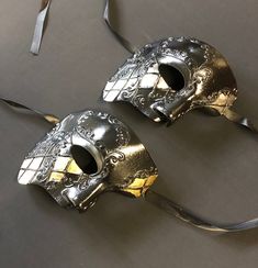 These Phantom Masquerade masks have unique raised detail design and are hand painted. Masks are available in black silver or black gold.  Great for Masquerade mask style events. Size 6" x 6" masks sold separately. Gothic Silver Mask For Masquerade, Silver Gothic Mask For Masquerade, Silver Masks And Prosthetics For Mardi Gras Theater, Silver Theater Mask For Carnival, Silver Masks And Prosthetics For Theater And Carnival, Gothic Silver Eye Masquerade Mask, Silver Gothic Eye Mask For Masquerade, Silver Masks For Mardi Gras Theater, Silver Gothic Eye Masquerade Mask