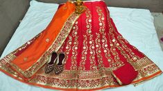 "Thank you very much for visiting my shop. Material-Pure Chinon Lehenga with Heavy Aari work Gota Patti Lace Border Lengha Dupatta - Chinon Dupatta with Gota Patti Work Accompanied with unstitched blouse piece Blouse- chion fabric  Blouse - Running Blouse Blouse length: 0.80 mtrs Waist Size : 42 Lenght  42 Note : WE ARE GIVEN FREE Rajasthani jhutti We are having expert staff in stitching .We are also take orders for dance performance, stage performance, marriage party, theme dresses, and any other demand etc.    Easy to wear and very comfortable  *Fancy Juti free free free*  PLEASE SHARE YOUR JUTTI SIZE IN MESSAGE ONLY              It Gracefully Add Style To Your Attire & Match With Your Confidence Disclaimer: Colors may slightly vary due to Photographic effects IMPORTANT NOTE : Please Be Bandhani Chaniya Choli, Lehenga Bandhani, Chinon Lehenga, Gotta Patti Lehenga, Rajasthani Lehenga Choli, Wedding Chaniya Choli, Rajasthani Lehenga, Bandhani Lehenga, Navratri Garba