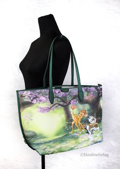 Style: Kate Spade X Disney Sutton Bambi Shoulder Tote Bag Material: Coated Canvas and Faux Leather Trim Features: Removable Pouch, Canvas Lined, Magnetic Snap Closure Measures: 21.5" L x 12.5" H x 6" D Shopper Tote, Waist Pack, Shoulder Tote Bag, 6 D, Kate Spade Bag, Shoulder Tote, Leather Trim, Belt Bag, Tote Handbags