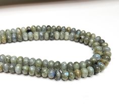 About this item AAA Top Quality Natural Labradorite. 12mm Faceted Rondelle Labradorite Gemstone Beads. Length: 38cm (15 inches). Labradorite is said to have several healing and metaphysical properties. It is a stone that is believed to subtly change your response to different situations in an emotional and physical way. It can be worn without having any tiring implications. Here, we will tell you about the healing and metaphysical properties of labradorite. Labradorite beads are excellent for DI Luxury Rondelle Natural Stone Beads, Diy Jewellery Designs, Pave Beads, Recycled Glass Bead, Labradorite Beads, Bone Beads, Czech Beads, Ceramic Beads, Natural Beads