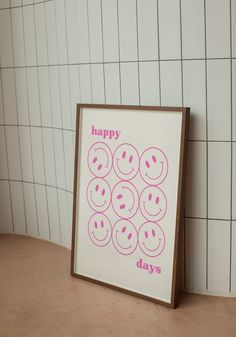 there is a sign that says happy days with smiley faces in pink on the front