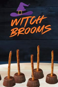 four chocolate candy candies with witches brooms on top and the words witch brooms above them