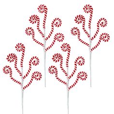 four candy canes with red and white stripes on them