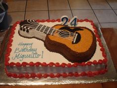 a birthday cake with a guitar on it