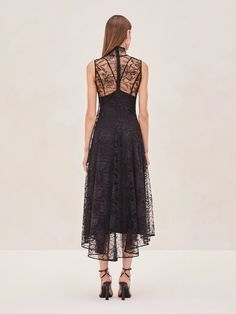 Meet the Rhiane Lace Midi Dress—a blend of elegance and edge that's designed to turn heads. This piece is all about versatility. Wear it with the slip for a more classic, refined look, or without if you're feeling daring. The intricate lace detailing adds a touch of romance, while the sheer fabric keeps things modern and unexpected. Whether you're dressing up for an event or just want to make a statement, Rhiane is your perfect go-to. Elegant Sheer Midi Dress For Gala, Elegant Spring Evening Dress With Lace Trim, Delicate Lace Sleeveless Gala Dress, Elegant Evening Dress With Lace Trim For Spring, Black Sleeveless Lace Dress With Delicate Details, Elegant Sheer Lace Evening Dress, Elegant Spring Evening Dress With Scalloped Lace, Elegant Evening Dress With Delicate Lace, Elegant Sleeveless Evening Dress With Lace Trim