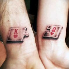 two people with matching tattoos on their hands