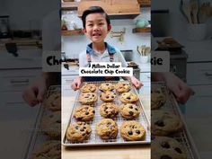 a young boy holding a tray of chocolate chip cookies in front of him is an advertisement for his new cookbook