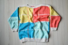 Very bright and warm wool sweater in ideal vintage condition. This 80s look color block jumper is handmade, thick  and super cute vintage treasure.  Great gift. The itchiness of wool on a scale of 0-5 for this item is 2 Vintage condition on a scale 1-10 is 9 Size : seems like men's (M) and women's (L) Measurements: Length: 71 cm/ 28" Shoulder to shoulder: 56 cm/ 22" Sleeve: 48 cm/ 19"  Chest: 122 cm/ 48" Fabric: wool, polyamide Brand: handmade * Hand wash only More vintage sweaters: https://www. Retro Winter Sweater With Color Matching, Retro Patchwork Knit Sweater, Retro Color Block Sweater For Winter, Retro Color Block Winter Sweater, Retro Winter Color Block Sweater, Yellow Patchwork Sweater For Winter, Yellow Patchwork Winter Sweater, Retro Yellow Crew Neck Sweater, Yellow Color Block Sweater For Winter