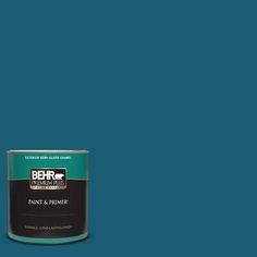 a can of behrold paint and primer in one on a green background