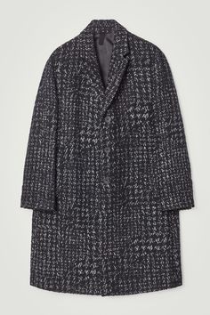 This modern overcoat will ease your wardrobe into the cooler months. It's made from structured bouclé enhanced with wool, cashmere and camel hair for a tactile handle and jacquard-woven with a distorted houndstooth pattern. Cut in a relaxed shape, it has unbuilt, dropped shoulders and is designed with tailoring-inspired features, such as the peak lapels, welt pockets and back vent. Relaxed fitButton closureA better alternative to conventional polyester, recycled polyester is made from pre‐ and post‐consumer waste  Shell: 35% Cotton, 31% Recycled polyester, 17% RWS Wool, 8% Recycled wool, 4% Recycled polyamide (Recycled nylon), 3% Camel hair, 1% Recycled cashmere, 1% Viscose. Lining: 100% Polyester. Excluding trims / Dry clean Back length of size 38R is 49.25" / Model wears a size 38R Cos Menswear, Wool Overcoat, Men's Coats And Jackets, Houndstooth Pattern, Outerwear Coats, Short Shirts, Mens Outerwear, Blouse And Skirt, Fashion Brand