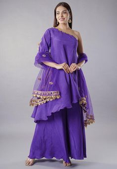 Readymade Cold Shoulder Art Muslin Silk Pakistani Suit in Purple. This attire with Cotton Lining is Enhanced with Lace Border Work. Crafted in One Shoulder Neck and Half Sleeve. Available with an Art Muslin Silk Sharara in Purple and a Net Dupatta in Purple. The Kameez and Bottom Lengths are 36 and 40 inches respectively.   Do note: 1.)Accessories shown in the image are for presentation purposes only and length may vary upto 2 inches. 2.)Slight variation in actual color vs. image is possible. Pakistani Sharara Suit, Party Wear Dresses Indian, Indian Party Wear Dresses, Pakistani Sharara, Wedding Outfits Indian, Readymade Salwar Kameez, Indian Wedding Outfit, Latest Salwar Kameez, Salwar Dress