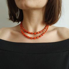 < Coral necklace with black beads > This product made according to the model of authentic traditional Ukrainian jewelry. The coral is modern, the design is vintage. Like 99% of the coral on the market these days, this coral has been dyed. I use bamboo coral which is not endangered or threatened in any way, unlike natural pink or red coral (the production of which is forbidden almost everywhere in the world). Bamboo coral doesn't mean it's not organic. Every bead of it has a distinctive and Orange Oval Beaded Necklaces As Gifts, Orange Oval Beaded Necklace For Gifting, Orange Oval Beaded Necklace For Gift, Orange Double Strand Beaded Necklace As Gift, Orange Double Strand Beaded Necklace For Gift, Orange Necklace With Black Beads For Gift, Gift Necklace With Orange And Black Beads, Orange Necklace With Black Round Beads, Vintage Style Women