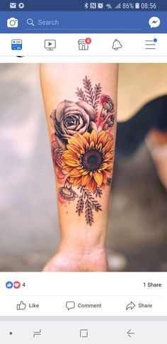 a sunflower and rose tattoo on the left leg, with other flowers around it