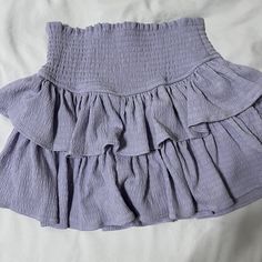 Ruffle Skirt. Never Worn Spring Solid Skirt With Ruffle Hem, Solid Color Tiered Skirt For Brunch, Spring Solid Skirt With Ruffles, Spring Skirt With Ruffles, Solid Color Skirt With Ruffles For Spring, Solid Ruffles Mini Skirt For Beach, Spring Ruffled Skort In Solid Color, Ruffled Skort For Spring, Spring Ruffled Skort