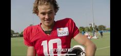 a female football player is posing for the camera