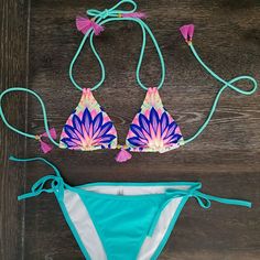 Super Cute Bright Vs Bikini Set. The Top Is Triangle With Light Padding And Has A Floral And Feather Looking Pattern To It As Well As Some Beating In The Center. It Is A Size Small. It Is Nwot. The Vs Tag Was Cut To Prevent Return So Only The Care Tag Remains. The Bottoms Are A Size Small And Tie At The Sides. Bright Teal And Turquoise With Neon Orange, Pink, Purple, Blue And Yellow! The Tassel Zara Fuchsia Pink! So Cute Tasseled Swimwear For Beach Party Vacation, Tasseled Swimwear For Beach Party, Beach Party Tassel Swimwear, Fitted Beachwear Swimwear With Tassels, Summer Tassel Swimwear For Pool, Summer Blue Swimwear With Tassels, Blue Tasseled Swimwear For The Beach, Blue Tasseled Swimwear For Beach, Beachy Swimwear With Tassels For Beach Party