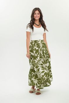 Are you looking for an easy, comfortable skirt? With tiered layers for movement and a flattering a-line cut, our Resort Skirt is your slip-on-and-go style for year-round wear. Style it for all seasons -- pairing it with a linen top in summer or adding a boot and a light jacket layer - you'll have a fall look. Maxi length Pockets Elastic waistband with drawstring tie Material: 100% Indian Cotton Care: Machine wash, hang to dry, or tumble dry low Studio model is 5'8" and is wearing a Small Vacation Maxi Skirt With Elastic Waistband, Relaxed Maxi Skirt With Elastic Waistband For Vacation, Flowy Green Maxi Skirt For Vacation, Relaxed Vacation Maxi Skirt With Lining, Vacation Maxi Skirt With Lined Relaxed Fit, Relaxed Lined Maxi Skirt For Vacation, Tiered Maxi Skirt For Vacation, Flowy Green Bottoms For Vacation, Green Flowy Bottoms For Vacation