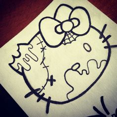 a drawing of a hello kitty with a bow on it's head and the words hello kitty written in black ink