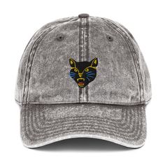 This acid wash dad hat features Timelements embroidered design Mad Cat. A fierce, funky icon that will add a feline beat to your casual everyday outfit. Punk rock, wild, fun.   Features:   • TimeElements Mad Cat embroidered design  • 100% cotton twill - Acid wash • Low profile, 6-panel, unstructured cap •Metal snap buckle with an antique brass finish  Shipping from the USA Adjustable Soft-washed Hats For Streetwear, Washed Black Snapback Hat For Streetwear, Washed Black Snapback For Streetwear, Casual Cat Design Hat, One Size Fits Most, Casual Cap With Cat Design, Casual Cat Design Cap, Outfit Punk, Mad Cat, Dad Cap