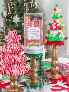 some christmas trees and candy canes on a table