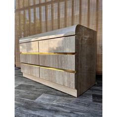 a large wooden dresser sitting on top of a tiled floor