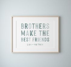 a framed print with the words brothers make the best friends in grey and green on it