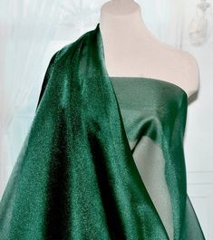 Width: 45" wide Length per listing: 1 yardPrice per yard is $4.50Type: Pageant Sparkle OrganzaColor: dark greenWeight:5 oz'sContent:  100% NylonCare: machine washableThis fabric is sheer where you can see your hand under it..  the picture represents fabric bundled to show correct color. Green Organza Tulle Fabric For Wedding, Elegant Green Fabric For Festive Occasions, Elegant Green Fabric For Wedding, Elegant Green Festive Fabric, Elegant Organza Fabric For Party, Fitted Green Festive Fabric, Fitted Green Fabric For Festive Occasion, Dress Skirts, Organza Shirt