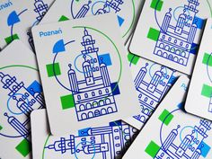 several cards with blue and green designs on them, all depicting different locations in the city