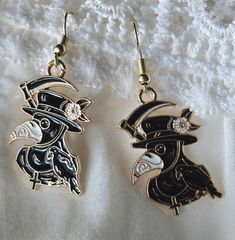 Plague Doctor Crow earrings. Gold tone. Hypo allergenic steel posts. Dangle earrings Black Novelty Drop Earrings, Novelty Drop Earrings, Pierced, Novelty Drop Earrings, Gold Novelty Pierced Earrings, Novelty Metal Earrings With Ear Wire, Crow Earrings, Doctor Earrings, Plague Doctor, Earrings Gold