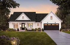 a white house with black shutters and two garage doors on the side of it