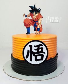 a dragon ball cake with the character gohan on top