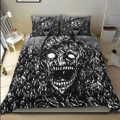 a bed with a black and white image of an evil monster on it's face