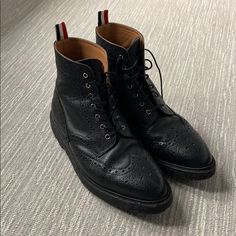 Gorgeous Men’s Thom Browne Leather Boot. Very Good Condition With Original Laces And Box Black Calf Leather Wingtip Shoes, Black Calf Leather Dress Shoes With Brogue Detailing, Designer Black Dress Shoes With Leather Lining, Designer Black Leather Shoes With Brogue Detailing, Black Leather Ankle Boot Dress Shoes, Black Business Boots With Textured Sole, Black Wingtip Boots For Business, Black Wingtip Calf Leather Boots, Black Calf Leather Dress Shoes With Round Toe