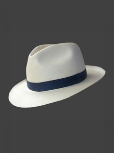 Brand: Gamboa PremiumColor: Natural Material: Toquilla Straw Brim: 7 - 7.5 cm. (2.76"- 2.96")Grade: 35 (Fine Fine)learn more Sweatband: Cotton Twill, 3 cm. (1.18") Crown: 10.37 - 10.87 cm. (4.1" - 4.3") Ribbon: Linen Description: A luxurious hat, handmade in Montecristi, the worldwide famous Panama Hat town in Ecuador. This Panama Fedora (Tuis) hat for men is a top quality, classic and elegant hat. Each hat is individually blocked and trimmed to meet the highest quality standards.Each Gamboa Premium Hat is presented in an elegant handmade raft wood box â€“ the ultimate hat gift box. White Formal Panama Hat With Short Brim, White Adjustable Panama Hat For Formal Occasions, Classic White Hat, Elegant White Fedora With Flat Bill, Classic White Hat With Flat Bill, Cuban Hat, Female Dreads, Poncho Mexican