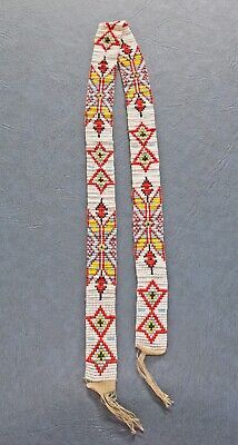 ad eBay - A very colorful, vintage handmade Native American beaded sash or belt. It is 31" long including the 2" string fringe at each end and is 1" wide. Has colorful repeating designs in light blue, red, yellow and black with white beads between the designs. The provenance and tribal affiliation are unknown. It is in excellent condition with no tears or missing beads. Please refer to the pictures for details of the designs. Native American Belt, Beaded Barrettes Native Americans, Beaded Art, Beaded Belt, Sash Belts, Native American Beading, Sash Belt, Yellow And Black, White Beads