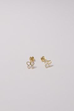 PLX438 Our XXS Double Heart CZ Screw Back Earrings are meticulously handcrafted in Korea. They beautifully blend classic and contemporary style, making them a unique piece of jewelry. Made from 14K solid gold, studded with cubic zirconia in a double heart design, these earrings not only offer durability but also emanate a sophisticated charm. Their screw back design ensures a secure and comfortable fit, perfect for adding a delicate and elegant touch to your everyday look or for special occasion Gold Cubic Zirconia Heart Earrings In Dainty Style, Gold Dainty Heart Earrings With Cubic Zirconia, Dainty Gold Heart Earrings With Cubic Zirconia, Gold Heart Earrings With Diamond Accents For Gift, 14k Gold White Heart Earrings For Gift, White 14k Gold Heart Earrings Gift, Elegant White 14k Gold Heart Earrings, Delicate Gold Heart Earrings For Anniversary, Korea Town