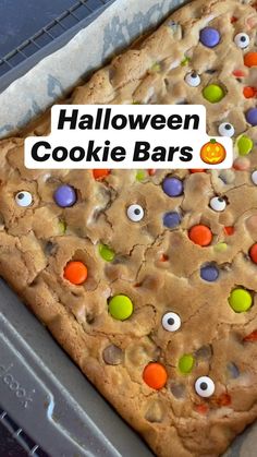 there is a cookie bar with candy eyes on it and the words halloween cookie bars