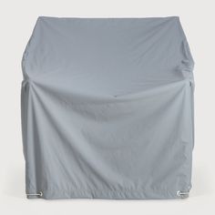 an outdoor furniture cover on a white background