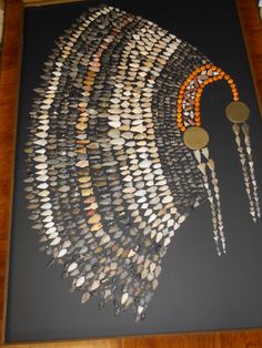 an art work made out of shells and beads