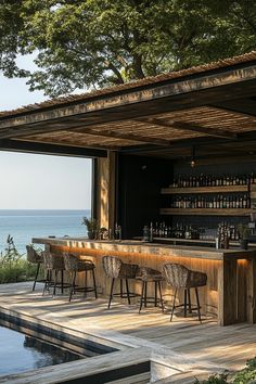 an outdoor bar next to the ocean