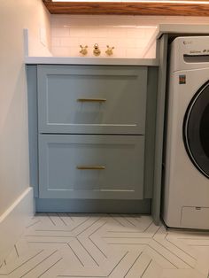 a washer and dryer in a small room