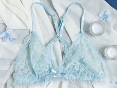 Elevate your bridal glow and slip on our lacy ruffle triangle bralette. A confidence-boosting bralette every bride deserves. 💍 Elegant Lace Bra For Wedding Night, Delicate Lace Wedding Bra, Feminine Wedding Bra With Delicate Lace, Feminine Lace Wedding Bra, Party Lace Bra With Delicate Straps, Feminine Triangle Top Bra With Delicate Lace, Feminine Delicate Lace Bra For Party, Summer Wedding Bra With Built-in Support, Feminine Wedding Bra With Delicate Straps