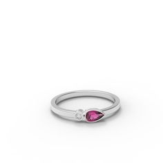 Dainty cluster ring set with a perfect Pink Ruby and a small diamond. Perfect for stacking or wearing solo. - Made to Order, perfectly finished, Fast shipping fully insured and trackable online. - Ruby info: 5x3 mm pear cut Ruby corundum, 0.25 ct - Diamond info: Single diamond, 1.75 mm VS-E, 0.023ct - Band width: 1.8 mm - Arrives gift ready with a certificate of authenticity. 14k White Gold Single Diamond Ring For Anniversary, Promise Cluster Ring With Birthstone In Fine Jewelry Style, Diamond White Ruby Ring With Diamond Accents, Classic White Ruby Promise Ring, Diamond White Birthstone Rings For Formal Occasions, Fine Jewelry Cluster Ring With Birthstone For Promise, Promise Cluster Ring With Birthstone, Ruby Ring With Diamond Center Stone, Fine Jewelry Diamond Birthstone Ring In White Gold