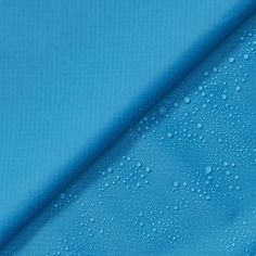 blue fabric with water drops on it