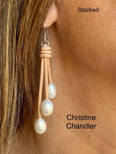 "This is a classic pair of pearl and leather dangling earrings that can be worn with anything.  There is a choice of 2 styles \"A-Frame\" or \"Stacked\".  There are 3 white freshwater rice style 10mm pearls on each earring.  The earrings dangle 2.5 inches.  You can order in any leather color.  Sterling Silver ear wires." Long Drop Pearl Earrings For Everyday, Everyday Long Drop Pearl Earrings, Elegant Leather Earrings As Gift, Elegant Leather Earrings For Gift, Elegant Leather Earrings Perfect For Gifts, Elegant White Leather Jewelry, Elegant Leather Earrings With Ear Wire, Elegant Teardrop Leather Jewelry, Elegant Leather Dangle Earrings