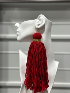 Introducing our Nhoma Pii Super Lightweight Yarn Earrings, a vibrant accessory available in two stunning variations. Each pair features 8 inch tassels with an 18k gold trim, creating a lively and eye-catching effect. Lightweight and stylish, these earrings are designed to effortlessly enhance any outfit, adding a touch of playful elegance and bold charm to your look. Traditional Red Jewelry With Tassels, Elegant Handmade Tassel Earrings For Festive Occasions, Festive Red Tasseled Jewelry, Handmade Red Tassel Earrings, Elegant Style, Handmade Elegant Red Tassel Earrings, Elegant Red Handmade Tassel Earrings, Elegant Handmade Red Tassel Earrings, Festive Red Tassel Earrings, Elegant Red Tassel Earrings With Fringe