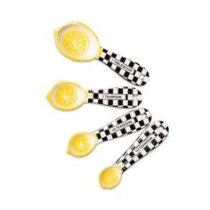 three lemons with black and white checkerboard designs are shown in the shape of spoons